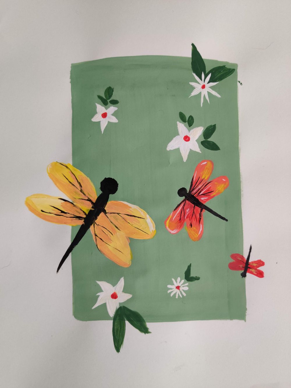 Painting of dragonflies and white flowers on a green block
